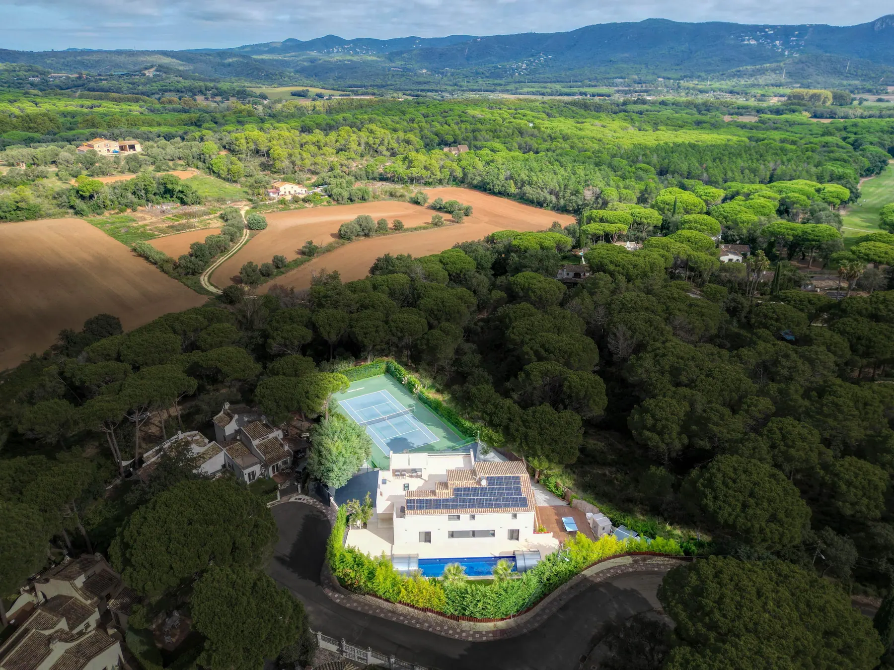 The estate from the air, surrounded by pine forest