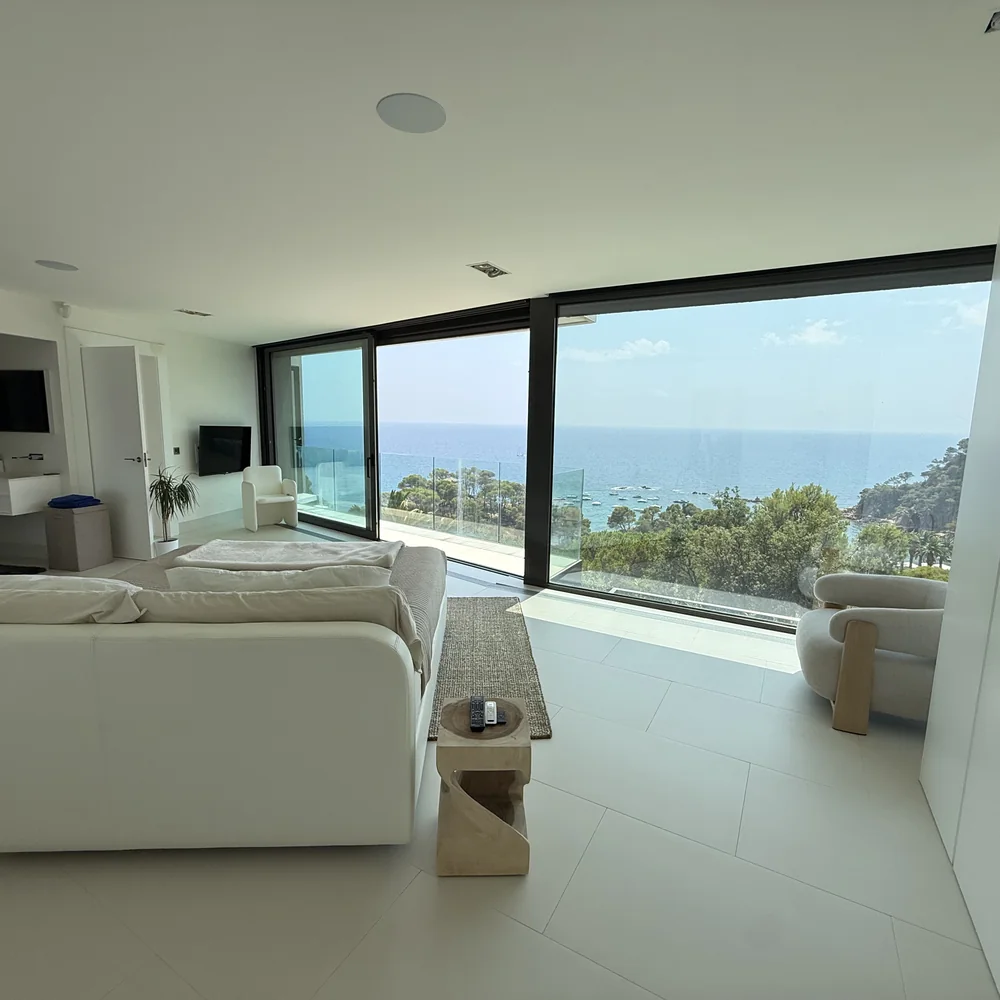 A bedroom suite opening onto the sea