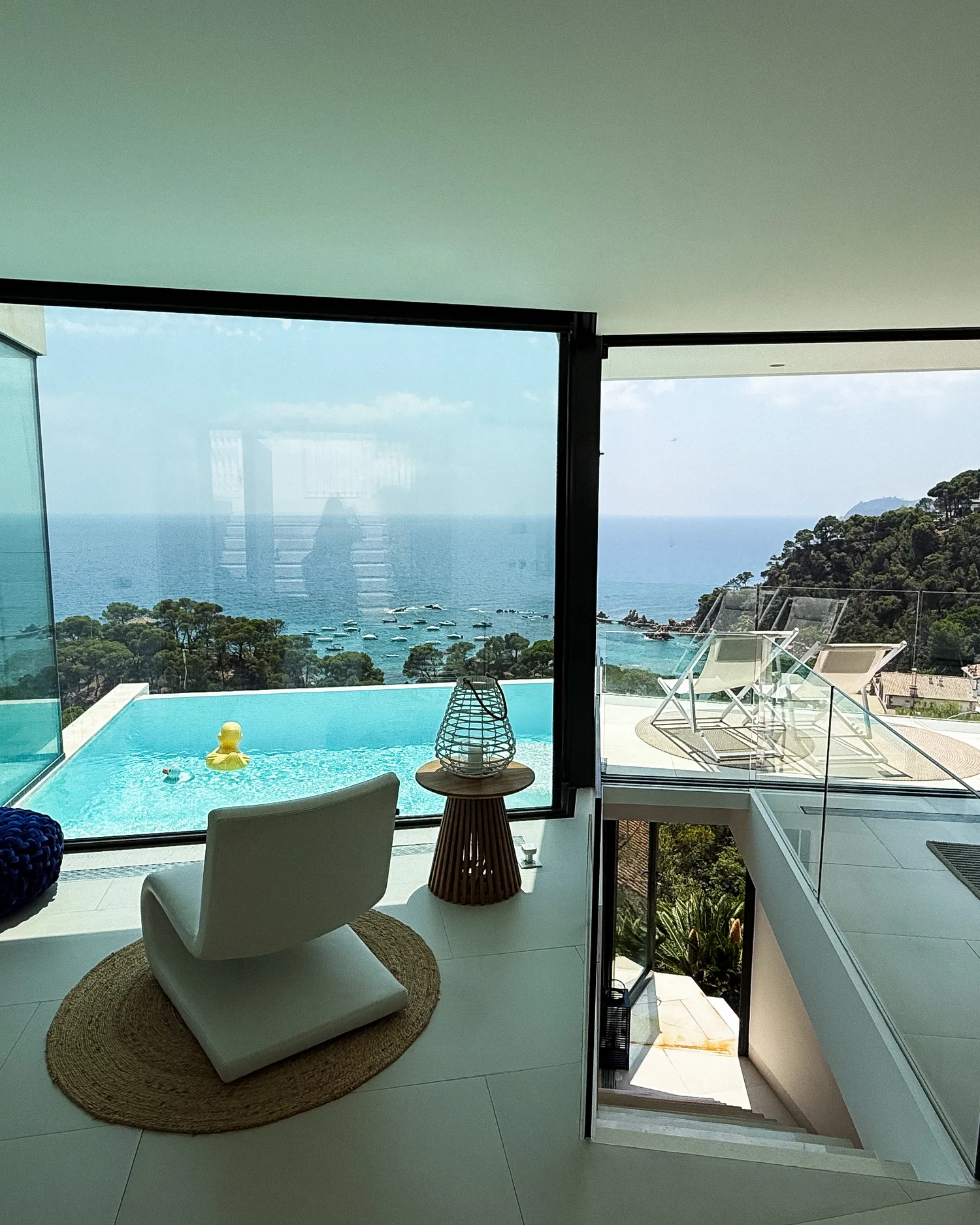 The living floor of Villa Rosamar, open to the pool and the bay