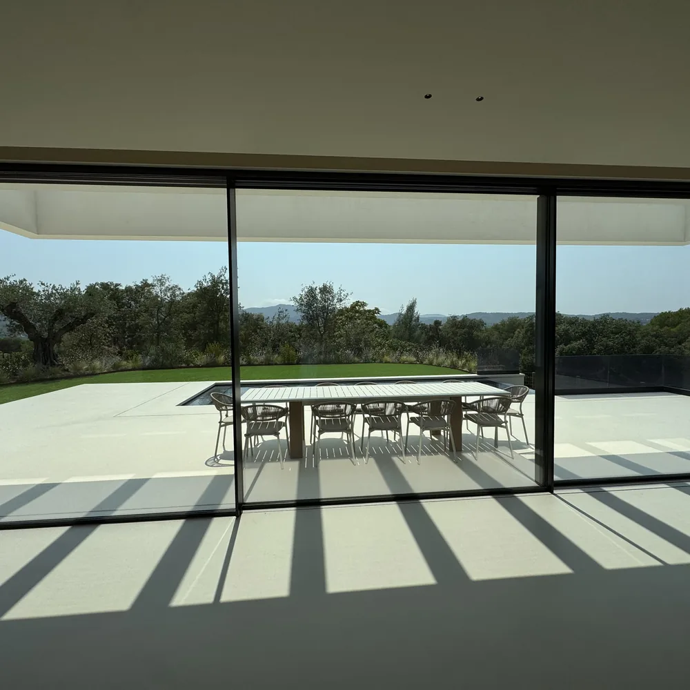 The dining terrace seen through the sliding glass