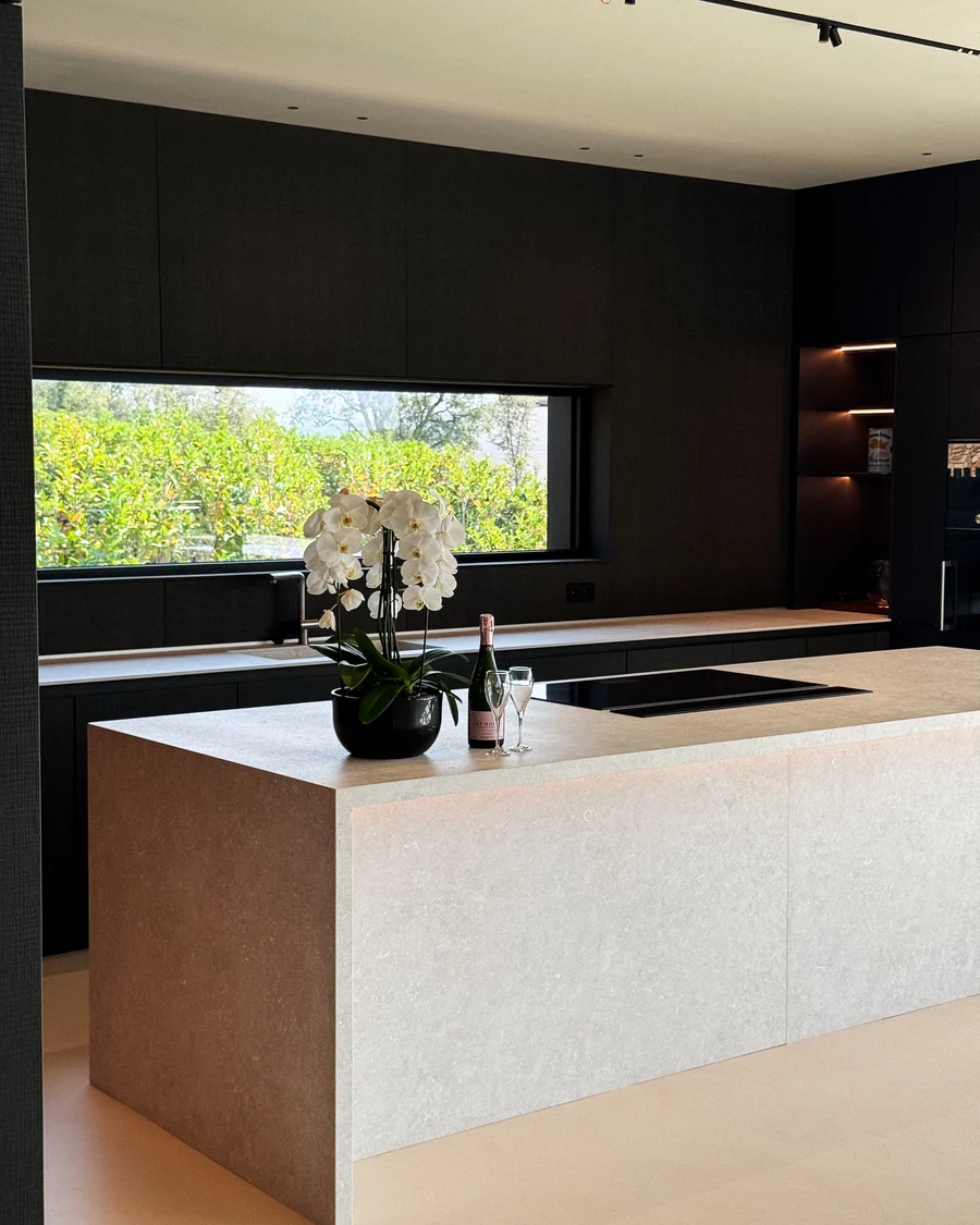 The kitchen island in stone, with the worktop returned to the floor
