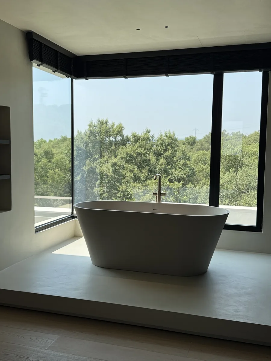 The main bathroom, with a freestanding bath at the window