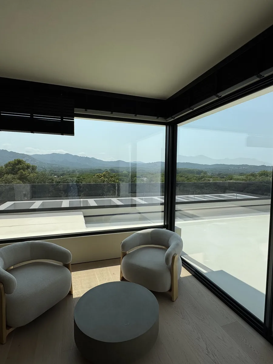 Living room with full-height glazing onto the terrace