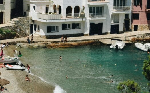 Whitewashed houses at the water in a Begur cove on the Costa Brava in summer