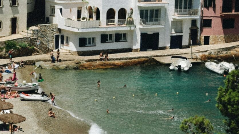 Whitewashed houses at the water in a Begur cove on the Costa Brava in summer